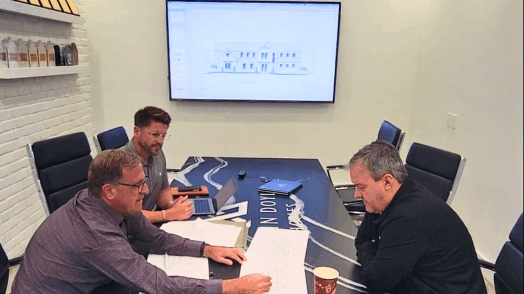 Justin Doyle Homes client experiencing their first custom home floorplan and rendering reveal, showcasing the design-build process in Cincinnati.