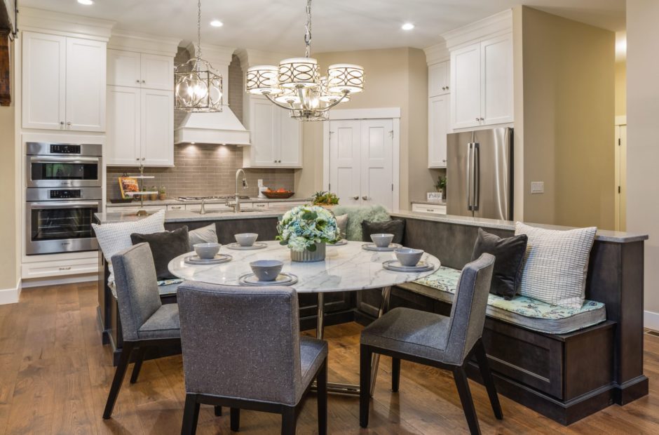 Kitchen and dining area in the Shaker Run Homearama home featuring a large island, custom cabinetry, and open-concept layout by Justin Doyle Homes