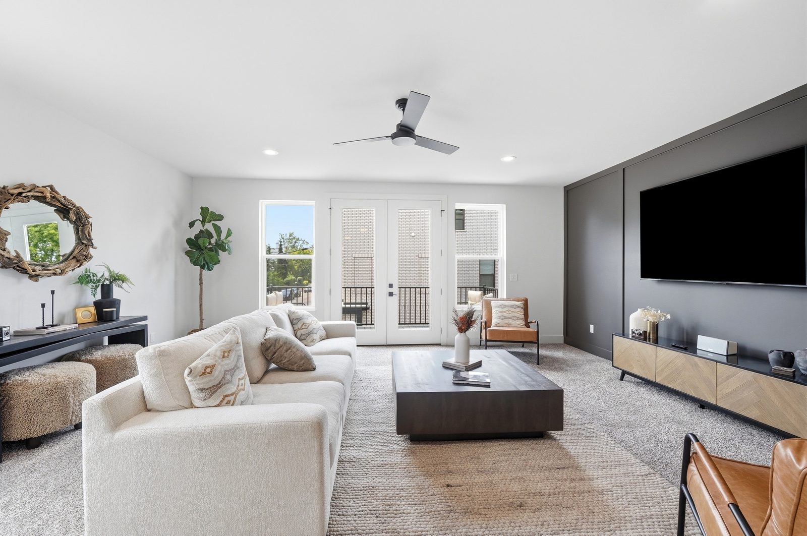 Living room in a Lebanon Landing 3 bedroom townhome with French doors opening to a private deck