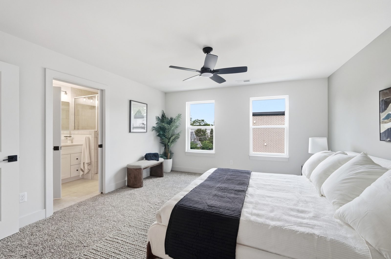Primary bedroom with ensuite bath on the top floor of a Lebanon Landing townhome