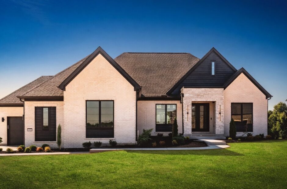 Breckenridge custom ranch home exterior by Justin Doyle Homes — white brick and stone with dark accents, black-framed windows, and professional landscaping in Cincinnati area
